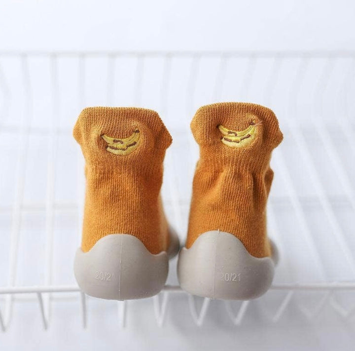 mustard sock trainers with stitched banana detail on the back 