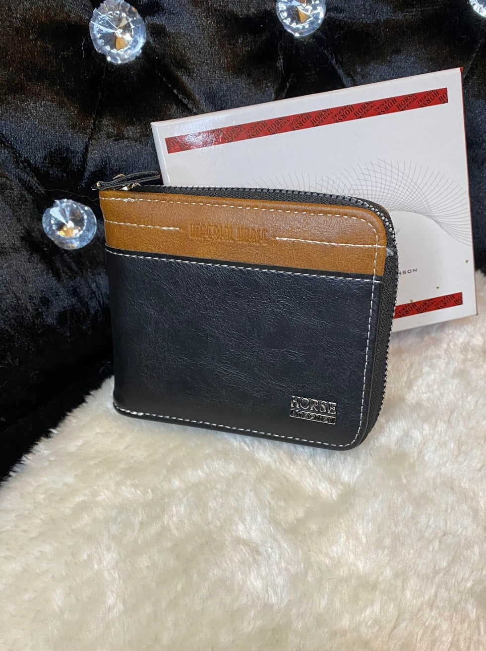 A men’s black and brown detailed wallet