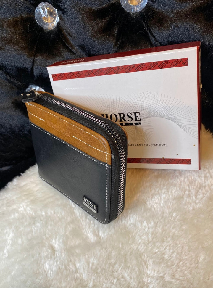 A men’s black and brown detailed wallet