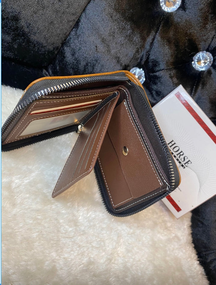 A men’s black and brown detailed wallet