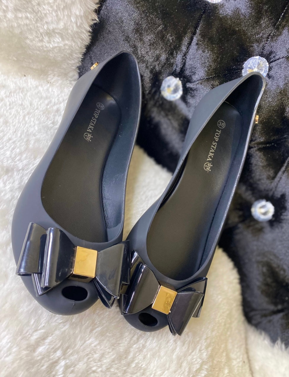 Black bow and gold buckle ballet shoes