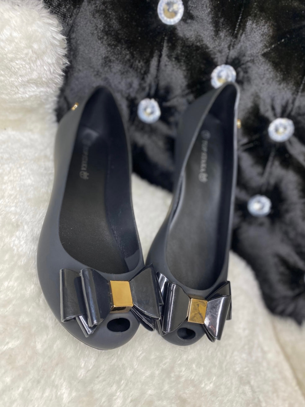 Black bow and gold buckle ballet shoes