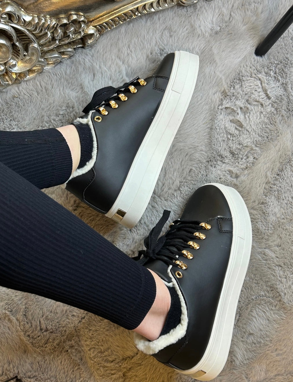 Black faux fur lined trainers