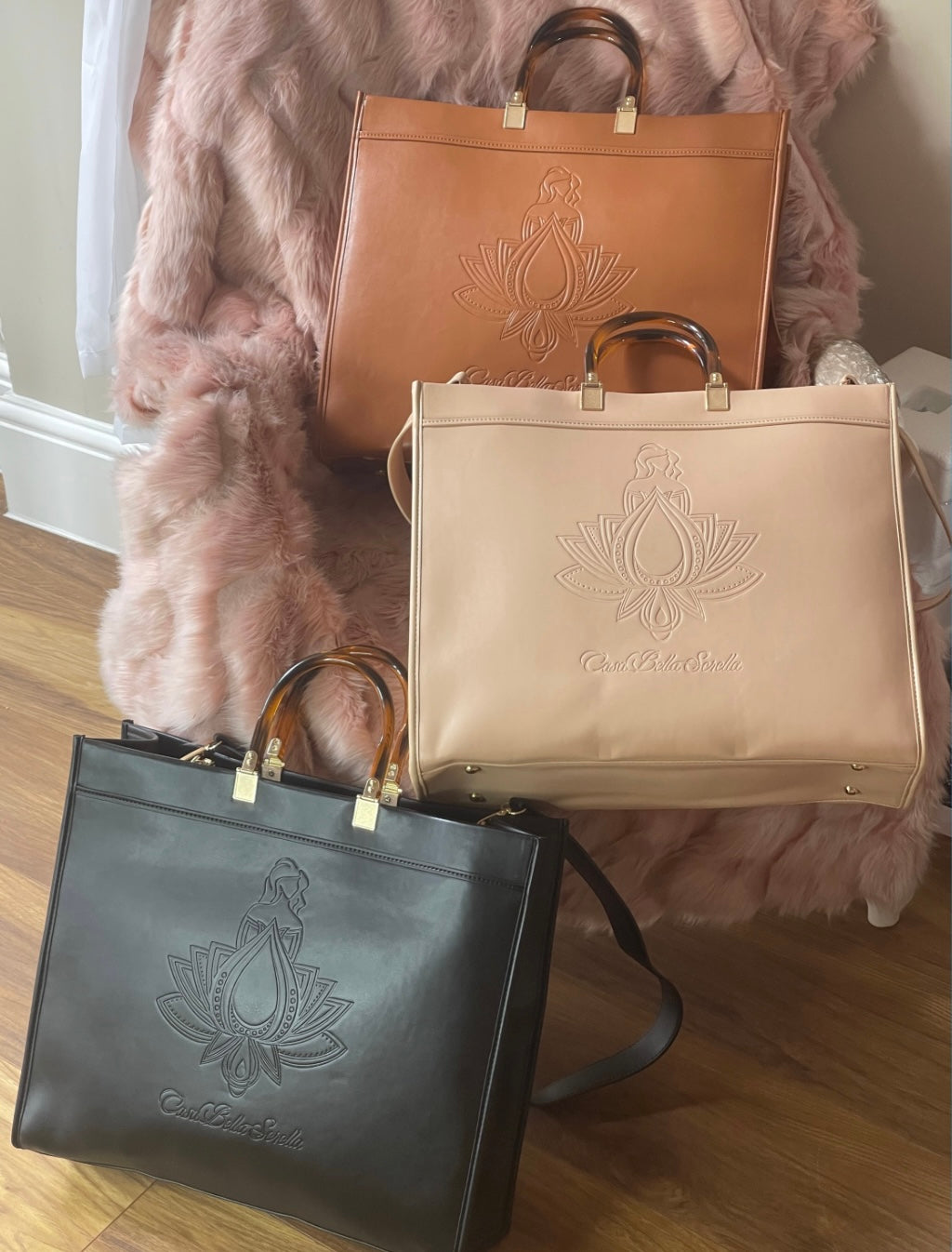Three colours of the faux leather cbs tote bag in brown, nude and black