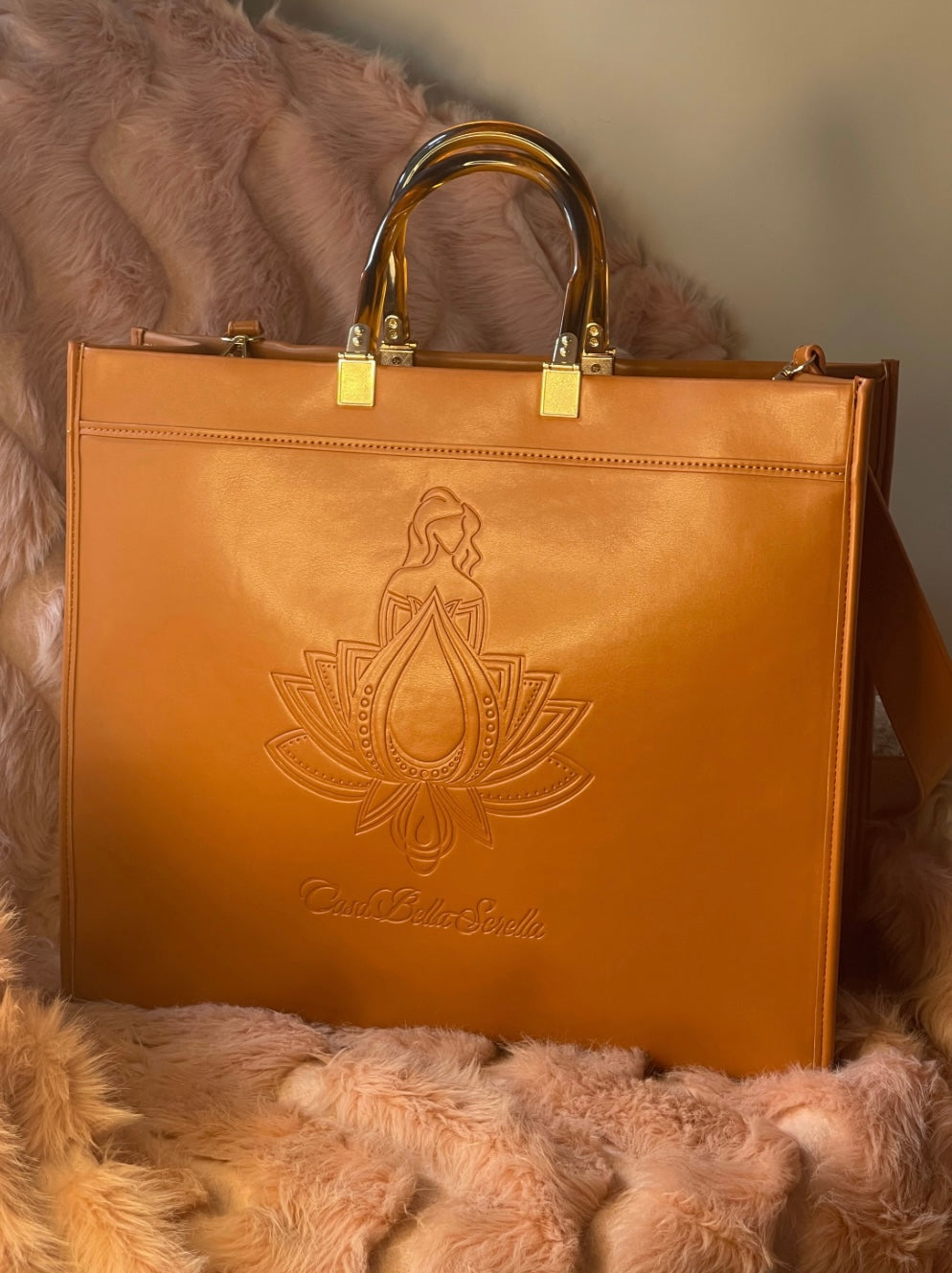 tan faux leather tote bag with the cbs logo on the front