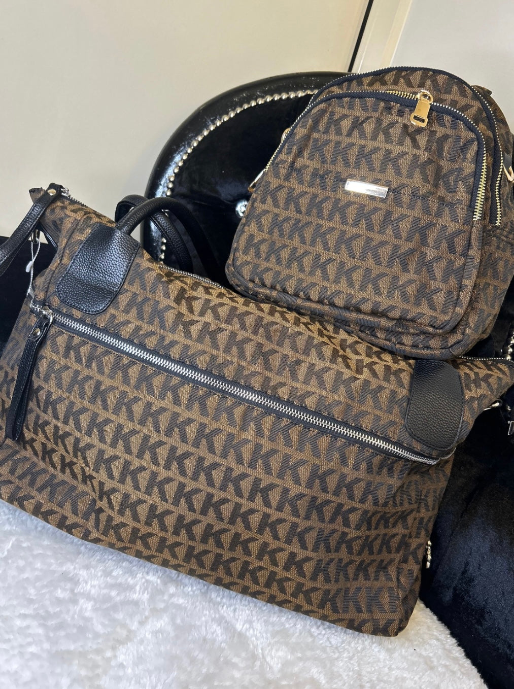 brown monogram travel set with KK print – women’s backpack and large weekend duffle bag with black handles and gold zip details